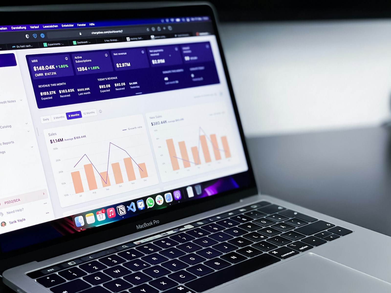 Analyst reviewing a financial information dashboard on a laptop